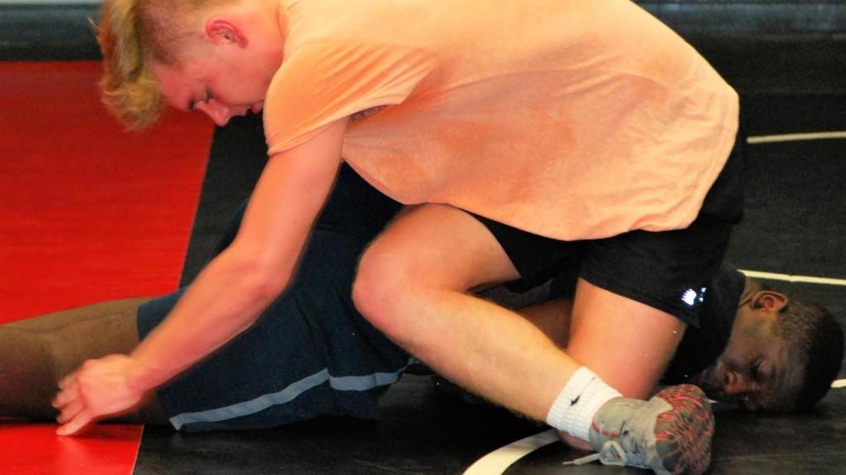 Nation Ford wrestler Jakob Gravely (top) and Jason Nunoo work during practice last week. the core of the Faclons’ ever-improving team is back for another campaign.