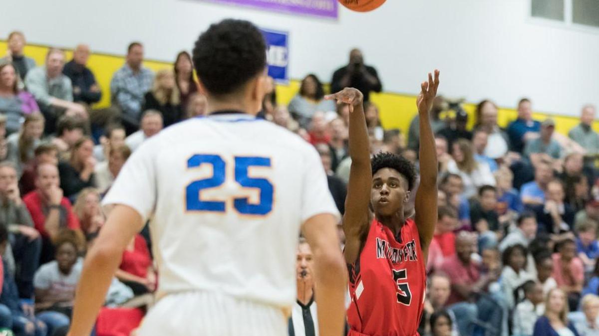 Zeb Graham of Nation Ford launches the deep ball in a win over Fort Mill to clinch the region title.