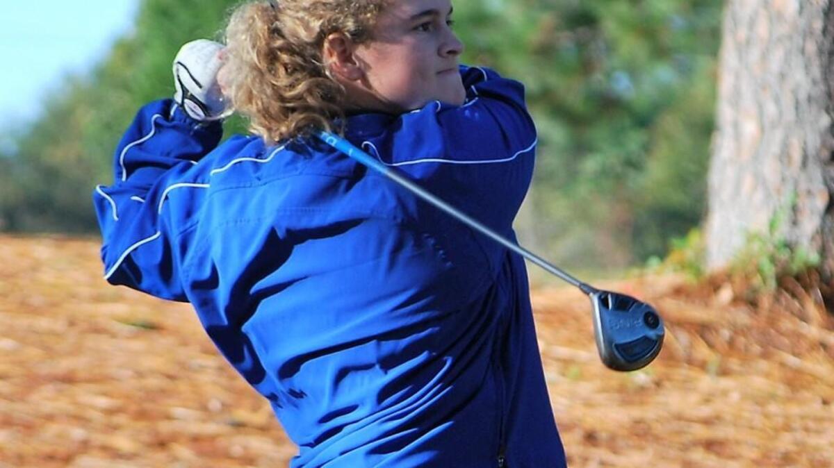 Fort Mill’s Lillie Smith hits her driver off the 10th tee at the Country Club of Lexington during the final round of the 5A state championship.