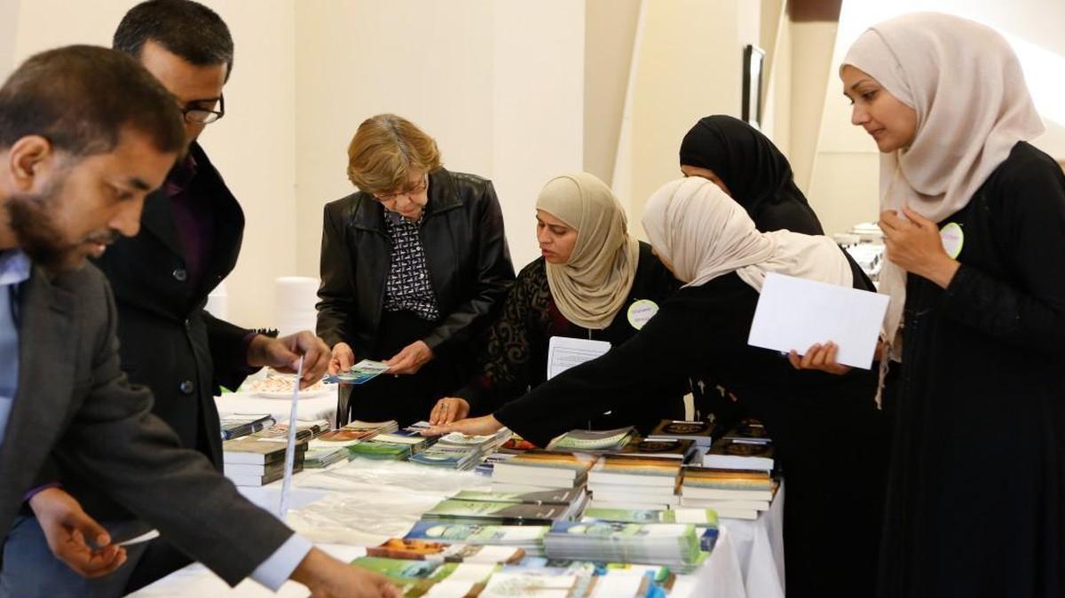 In this file photo, volunteers share literature with visitors as the Islamic Center of South Charlotte hosts a "Meet your Muslim Neighbor" event at their facility in Indian Land. A new mosque is planned not far from that site.