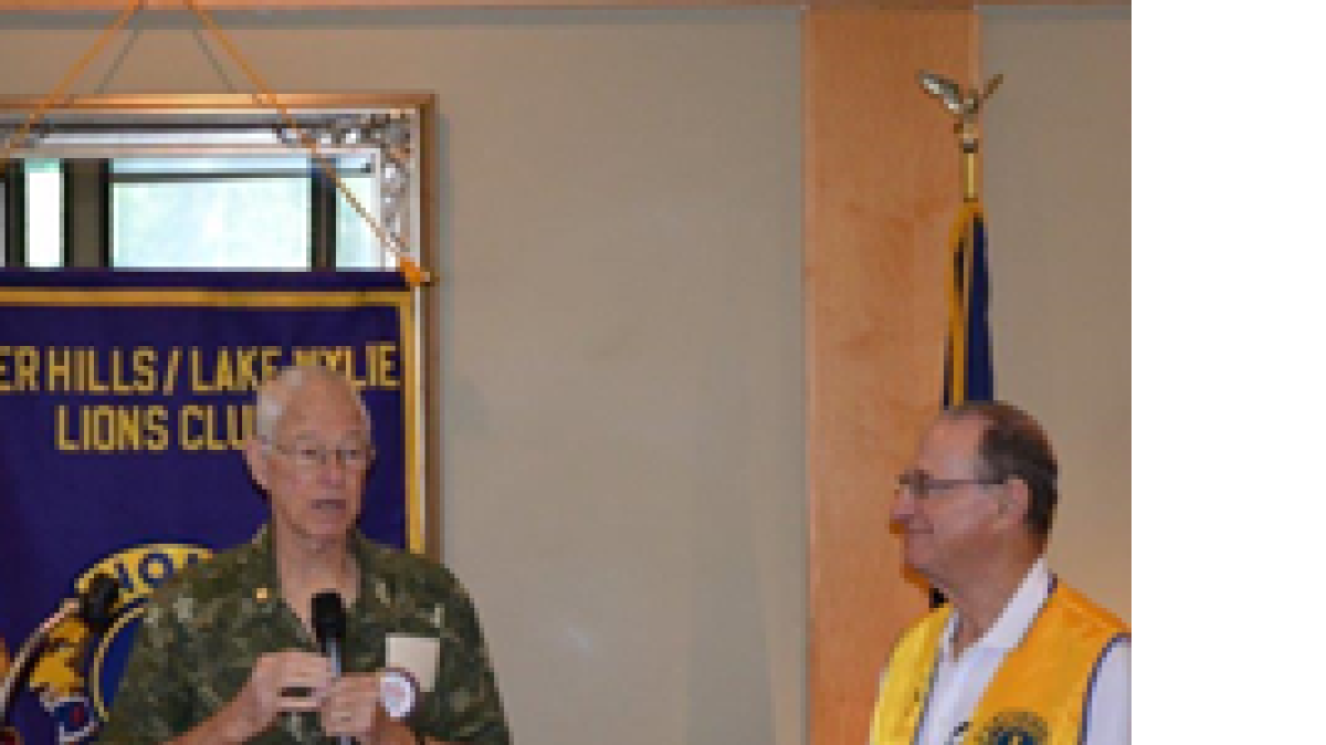 
Outgoing River Hills/Lake Wylie Lions Club president Lee Rowley hands the gavel to new president Len Fleet during the June 20 meeting at River Hills Country Club.
