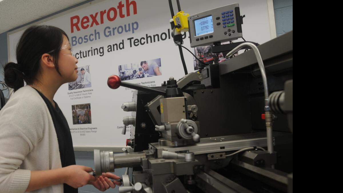 
Christine Chee works with a lathe at the new advanced technology center at Olympic High School in Charlotte, NC.
