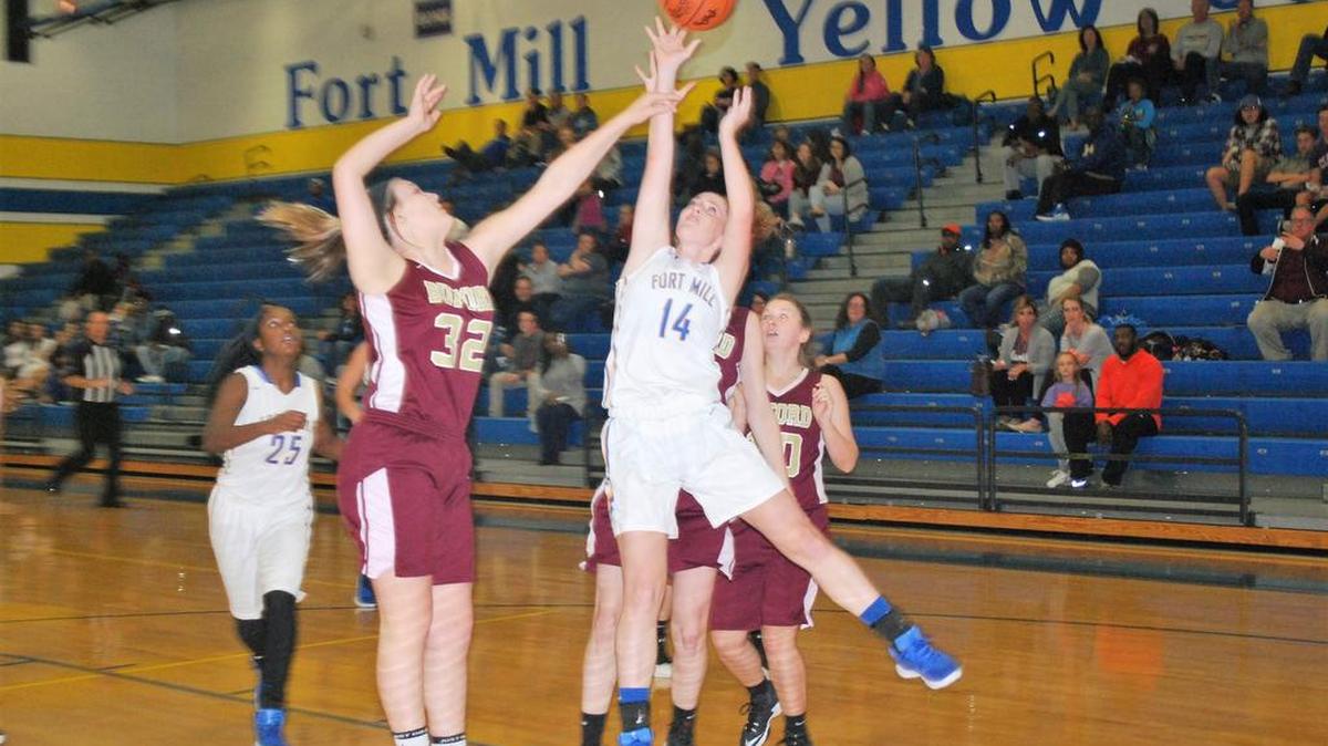 Fort Mill’s Annika Ford shoots over a Buford defender during the opening game of the Fort Mill Invitational.