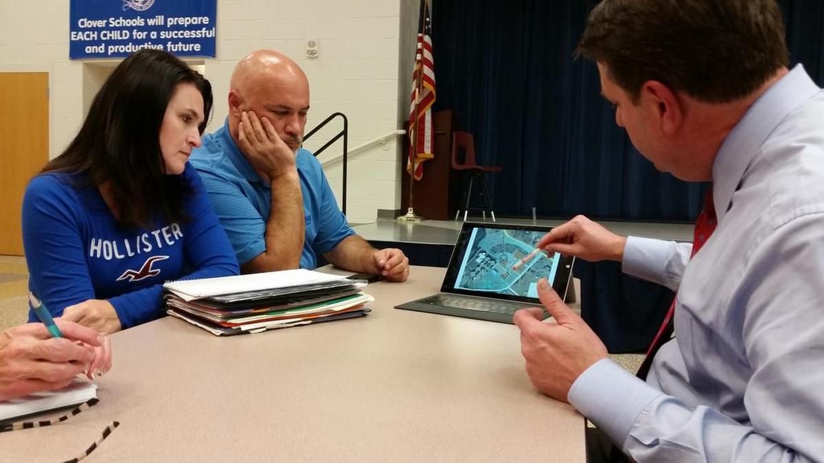 
Kim and Tony Trainer of Lake Wylie watch 16th Circuit Solicitor Kevin Brackett’s presentation about the $89.7 million York County bond referendum during a meeting Oct 13 at Oakridge Middle School. Voters will decide Nov. 3.
