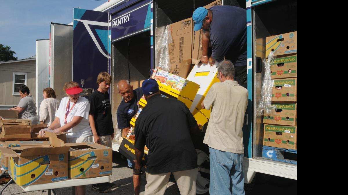 
Volunteers distribute more than five tons of food Wednesday at New Beginnings Baptist Church in Clover.
