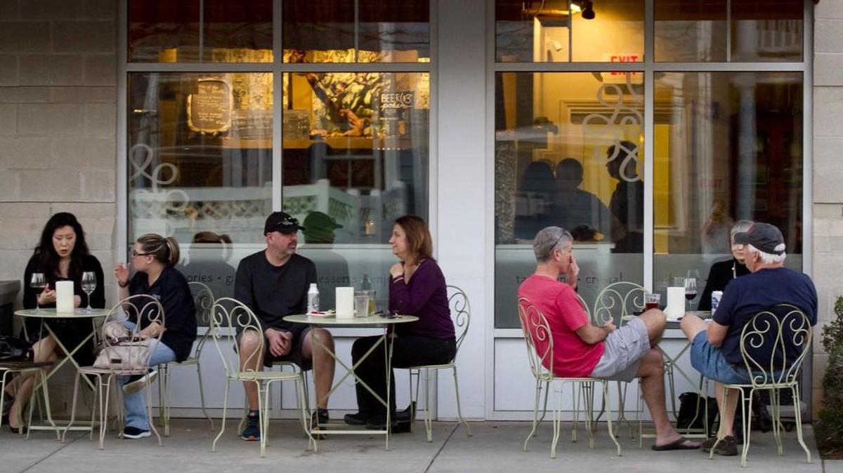 Patrons at the Grapevine Wine Bar in Baxter Village take advantage of the outdoor seating Friday. York County collects a 2 percent charge on food and drink in unincorporated areas like Baxter Village that is used to fund tourism projects. The “hospitality tax” brings in a little more than $2 million annually.