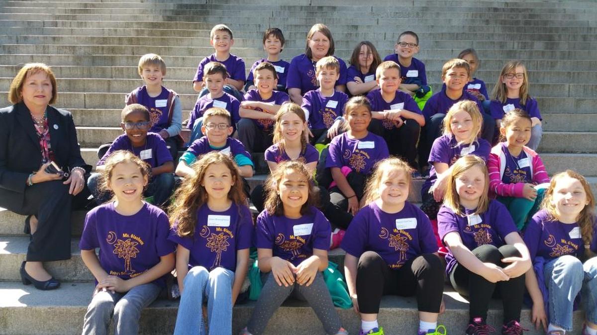 S.C. House District 26 Rep. Raye Felder sits for a photo with some of the Doby’s Bridge Road Elementary School third graders she hosted recently.