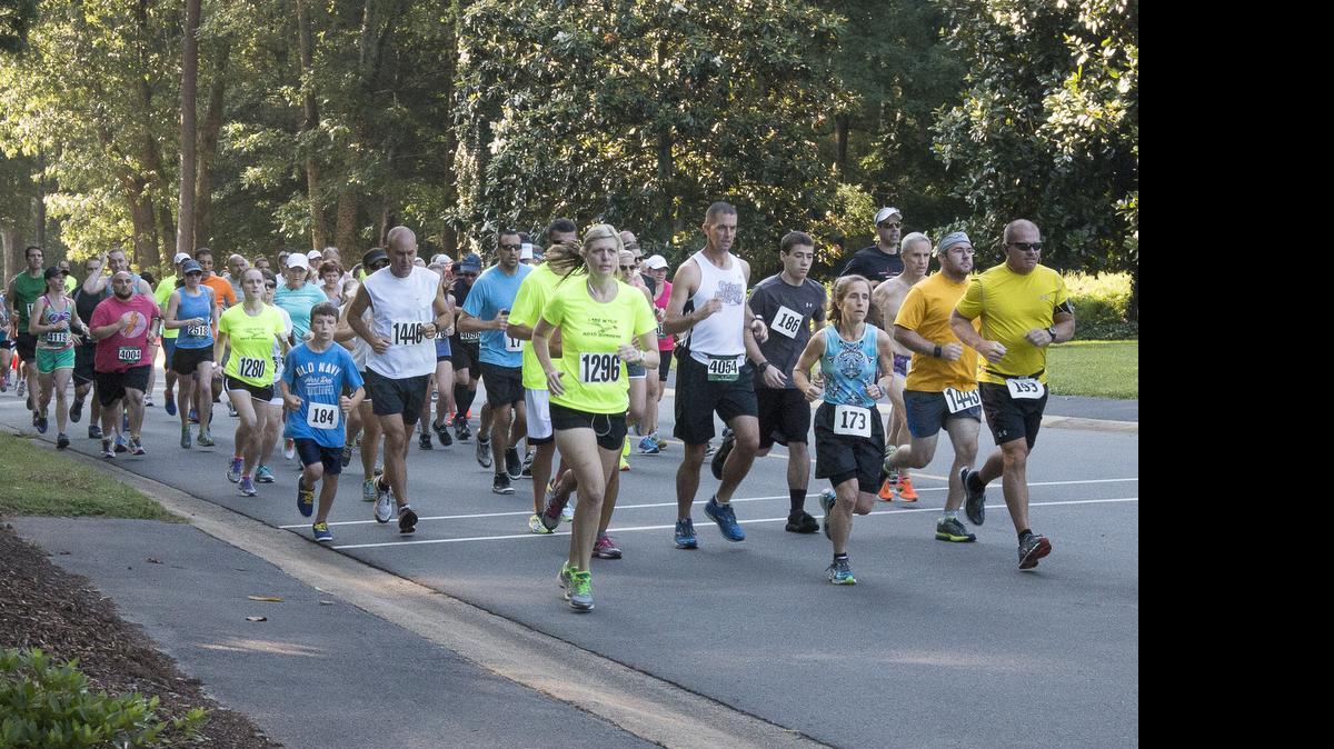 
Runners take off in the 2014 Lake Wylie Chamber of Commerce’s Splash Dash 10K and 5K at River Hills.
