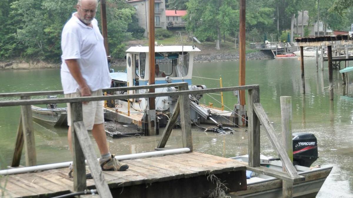 Bill Cullen overlooks his cove, where several feet of sediment were removed.