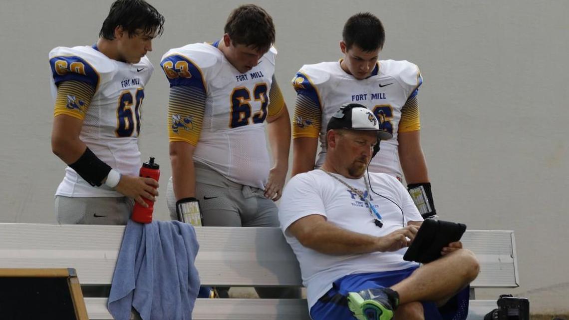 Cam Sponheimer (middle, No. 63) started an online petition encouraging Fort Mill High to hire offensive line and special teams coach Frank Ambrose.