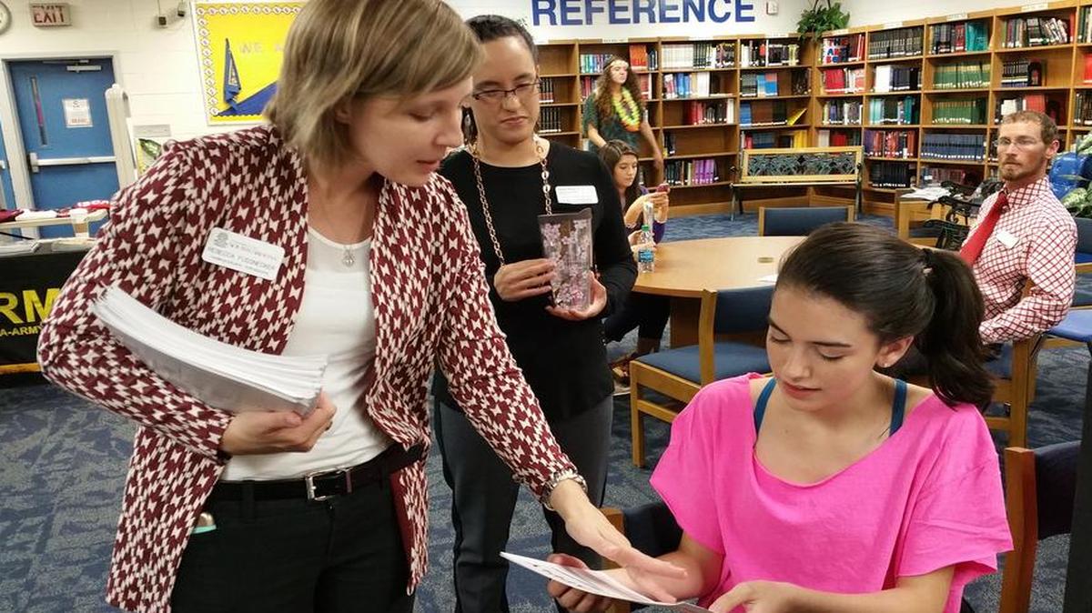 
Rebecca Fussnecker, admissions counselor for The University of South Carolina in Columbia, advises Samantha Terifay, 17, as she applies to college during College Application Day at Fort Mill High School. USC is Terifay's top choice.
