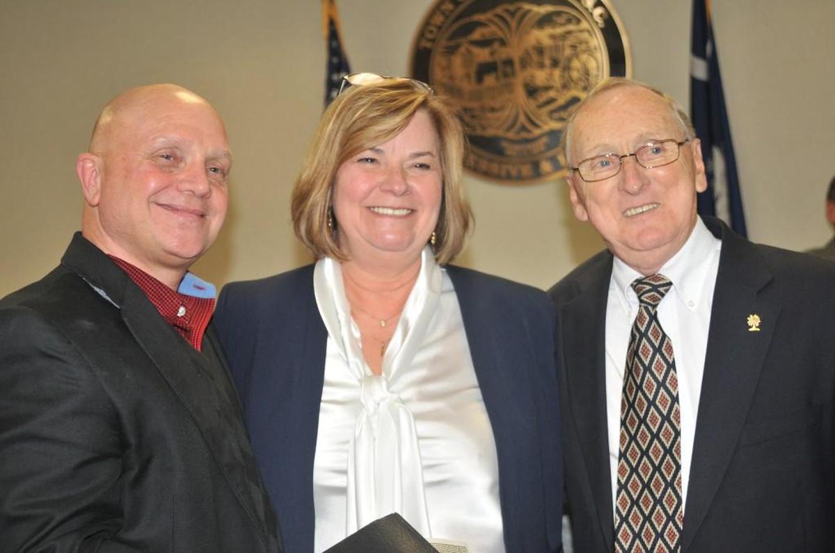 Fort Mill Mayor Guynn Savage, middle, is flanked by former mayors Danny Funderburk, left, and Charlie Powers, after her swearing-in in 2016. Compared to other S.C. municipalities, Fort Mill ranks toward the bottom in candidate filings and voter turnout.