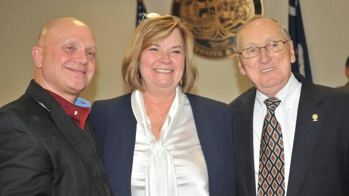 Fort Mill Mayor Guynn Savage, middle, is flanked by former mayors Danny Funderburk, left, and Charlie Powers, after her swearing-in in 2016. Compared to other S.C. municipalities, Fort Mill ranks toward the bottom in candidate filings and voter turnout.