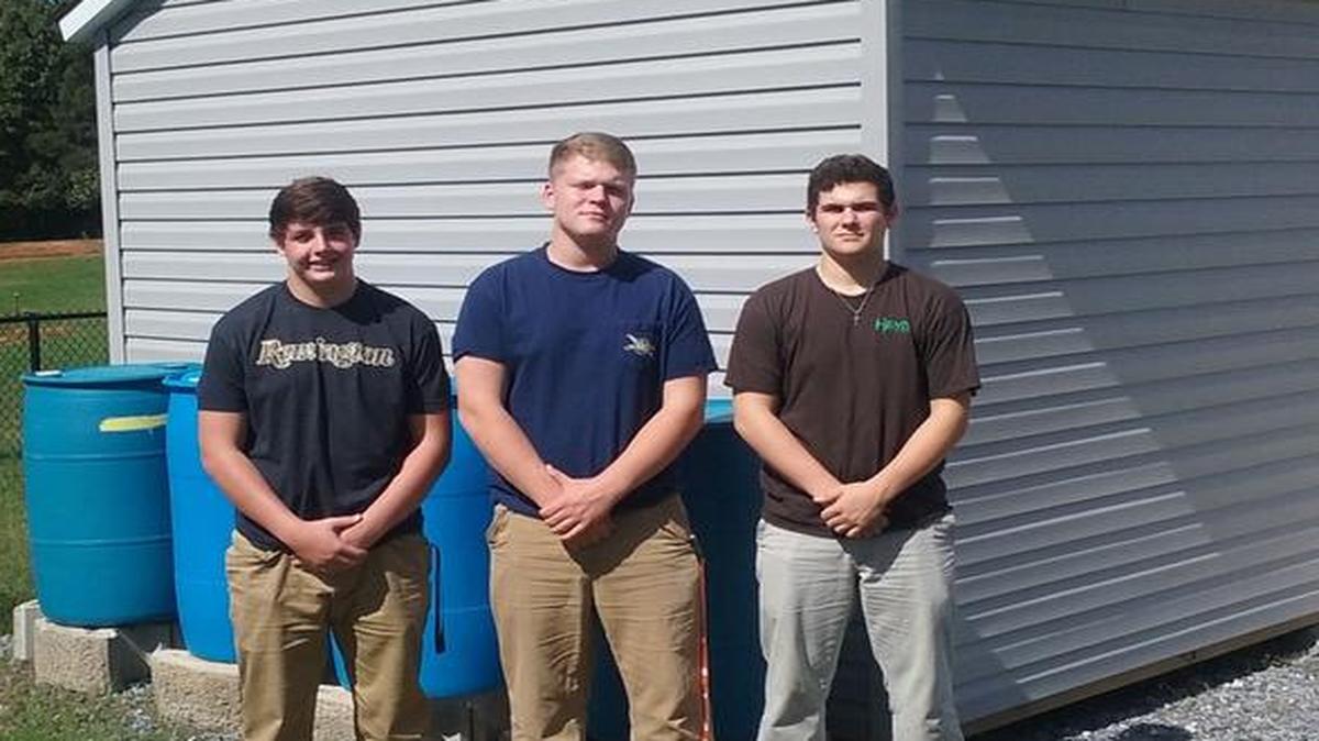 Fort Mill High FFA members Dalton Warren, Luke Scercy and Wade Brock lead the chapter’s rain barrel project.