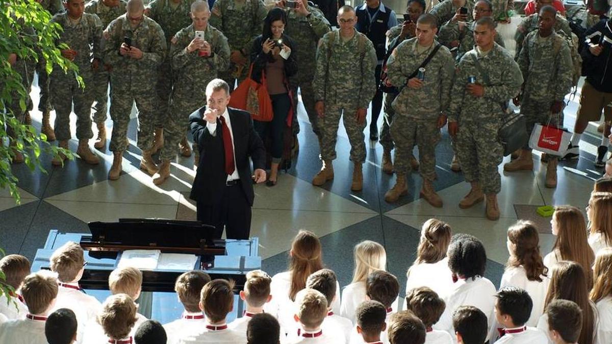 Oakridge Middle School’s Talon sang Dec. 18 to soldiers at Charlotte Douglas International Airport. OMS media assistant Magaly Thalacker said the soldiers did several military chants while marching in place and some joined in as the students performed.