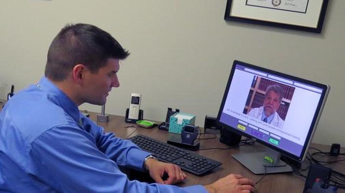 Gary Fike, owner at Palmetto Family Hearing Center in Fort Mill, demonstrates the brain training program the center uses to help patients listen, hear and communicate better.