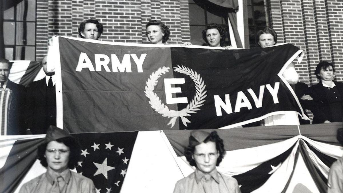 Springs Mills in Fort Mill received this banner, shown in the vintiage photo, for completing every wartime government contract on time for three years.