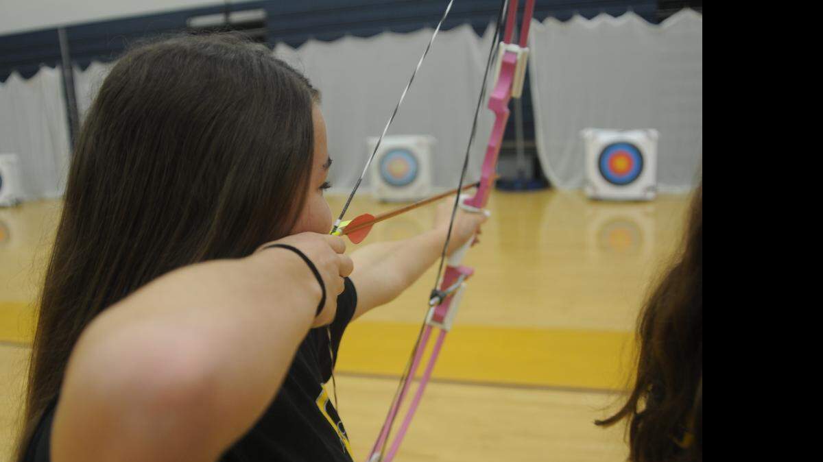 
Eighth-grader Alexa Roveri aims during a practice round April 17 at Oakridge Middle School.
