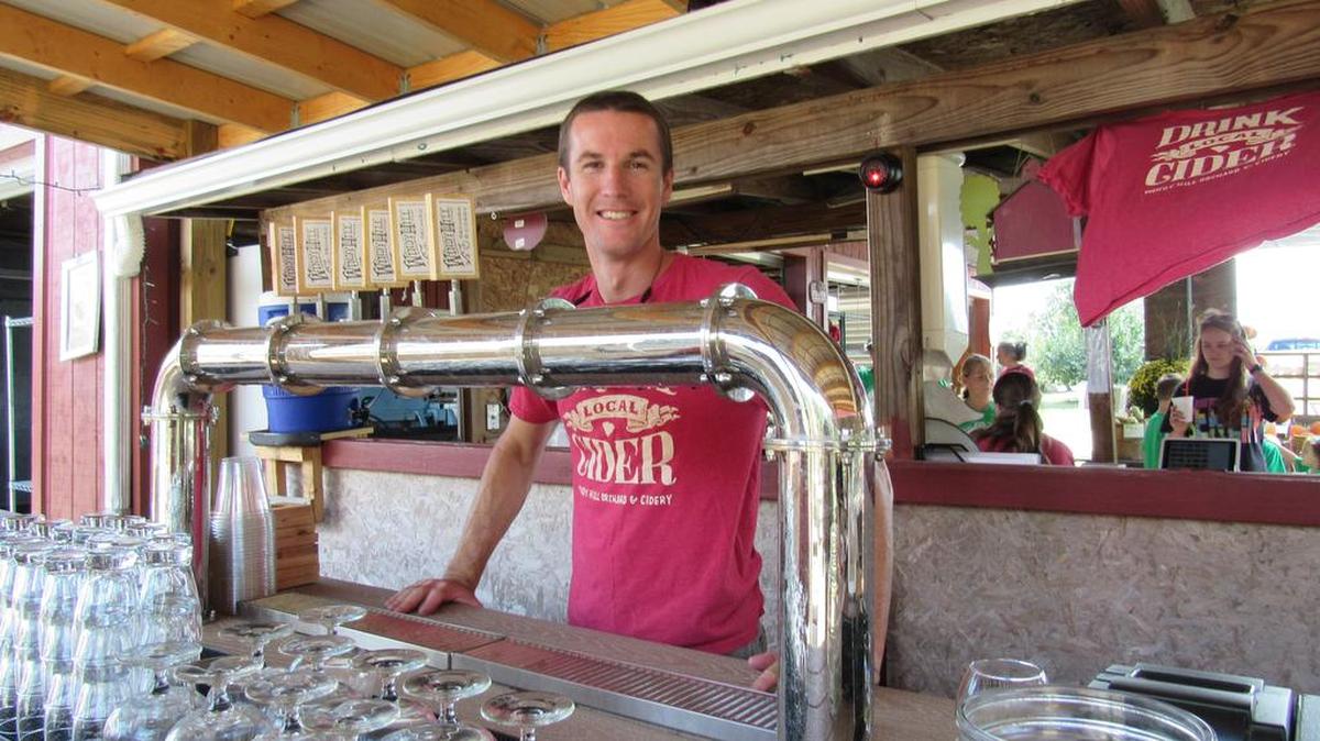 Matt Gusmer works at the hard cider bar at the family-owned Windy Hill Orchard & Cider Mill in York.