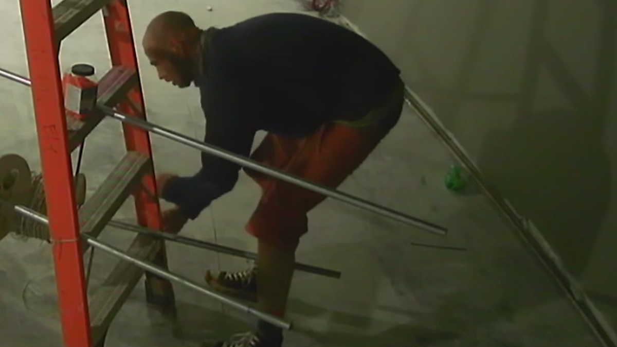 Police are looking for this suspect, shown on a surveillance camera image stealing electrical wire from an Indian land theater under construction.