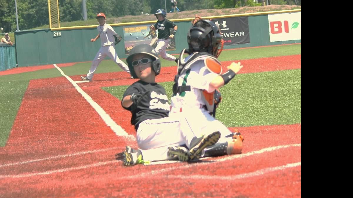 
Meredith McFadden of Steele Creek looks for the call after sliding into home plate during a recent baseball travel league game.
