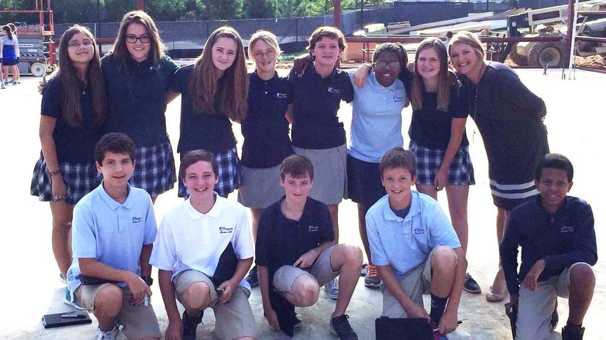 Palisades Episcopal School Head of School Kerin Hughes with eighth-graders who recently participated in The Global Read Aloud.