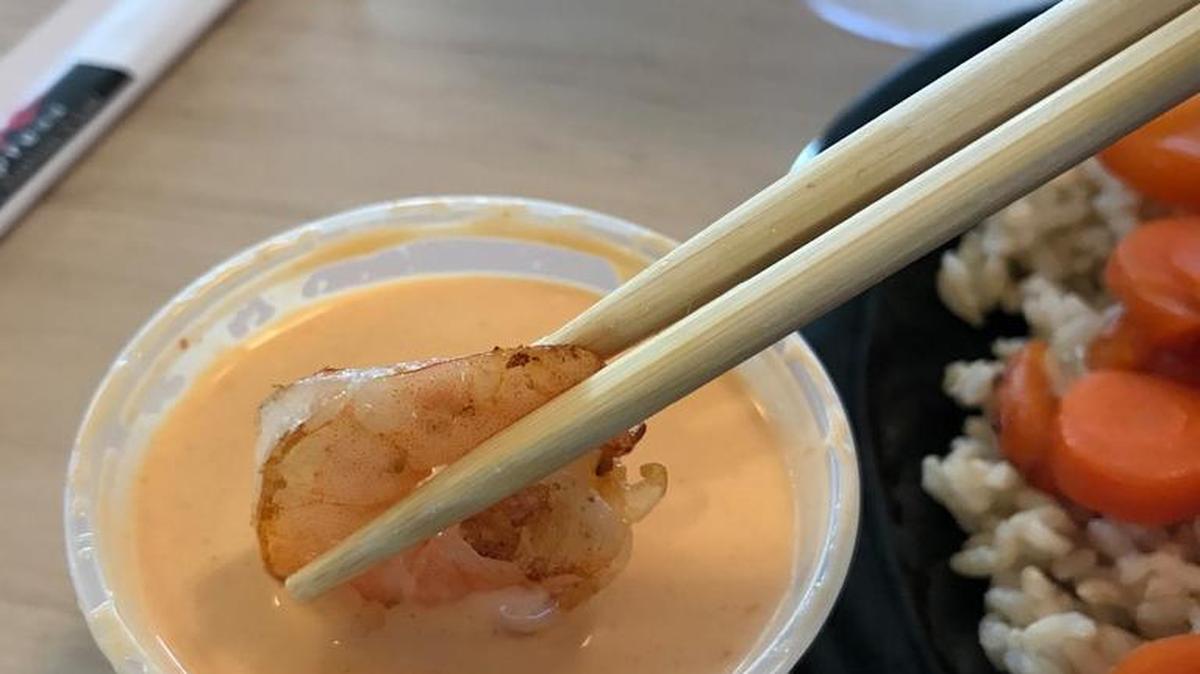 MHibachi shrimp, slightly browned, dipped in shrimp sauce at Sake Express in Lake Wylie.