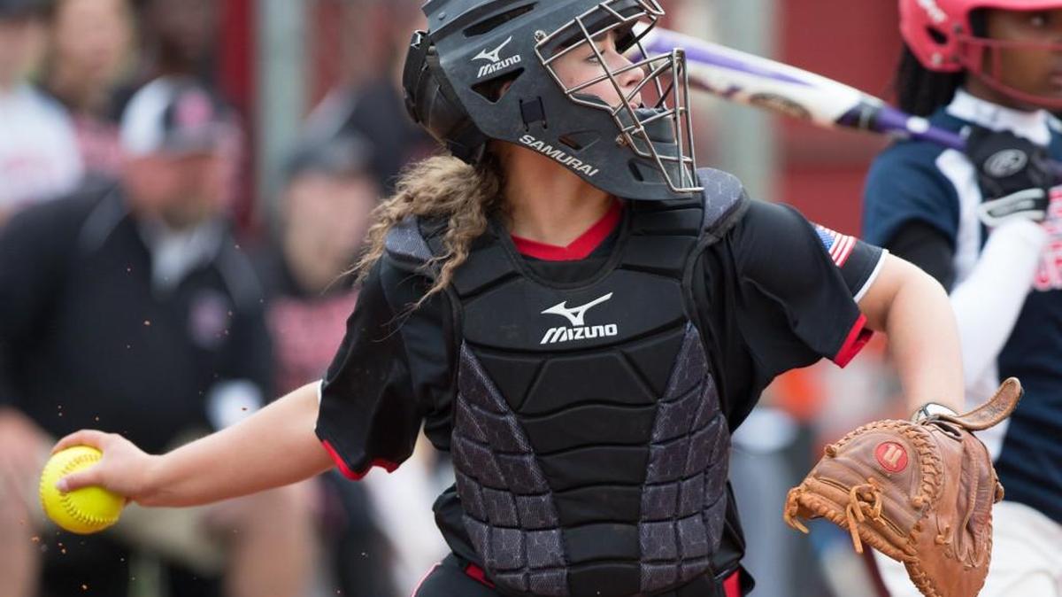 Sarah Riehlle of Nation Ford winds up before attempting to throw out a Chester run at third base in a game played April 19.