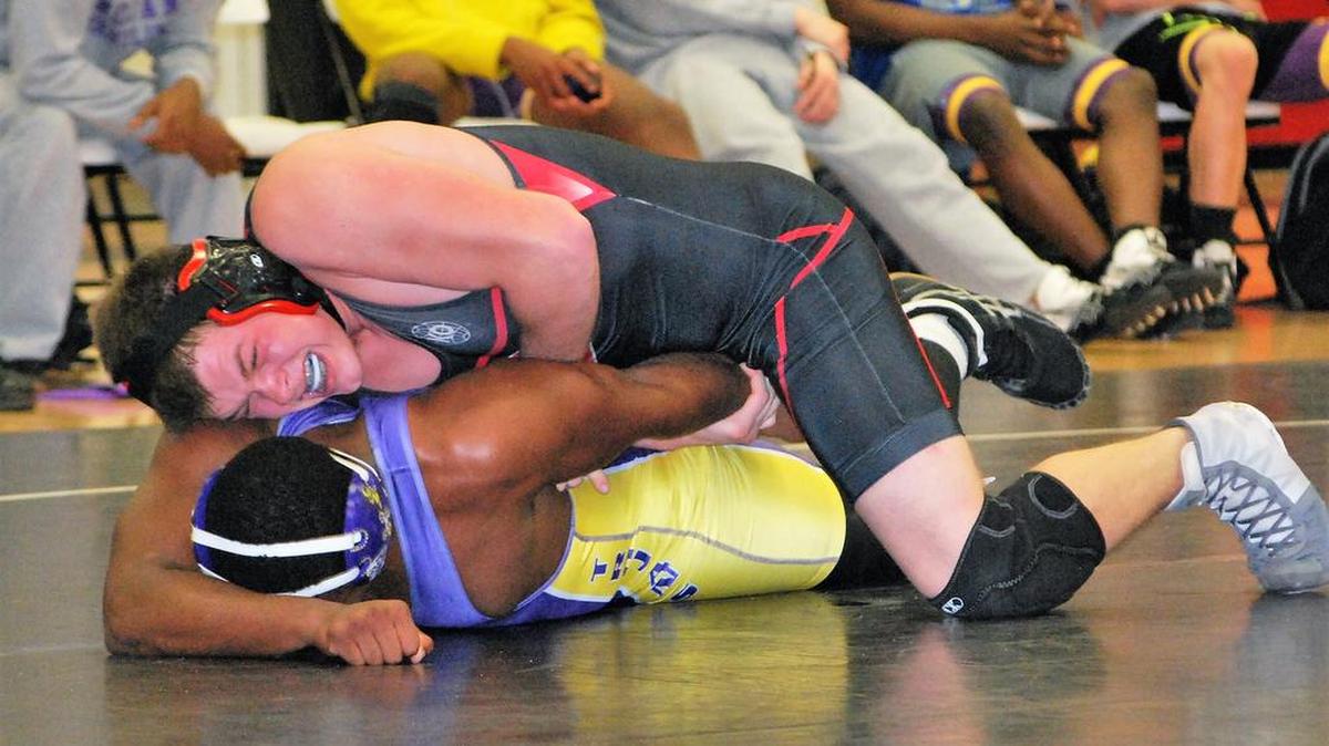 Nation Ford’s Steven Dodge (top) works on getting an advantage of his Northwestern opponent during last week’s dual. The Falcons came up just short in the dual, dashing hopes for a postseason berth.