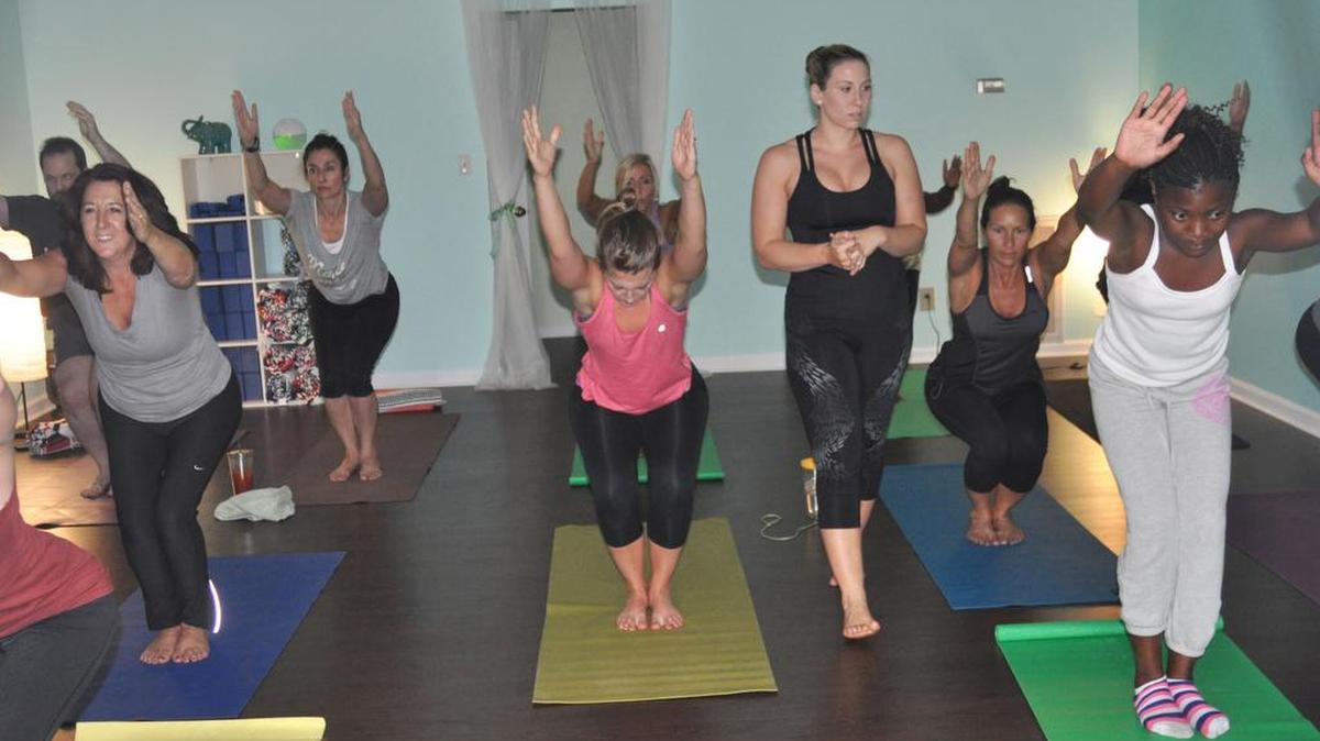 
Ashli Winter of Lake Wylie leads a class at her new business, Pure Bliss Yoga, at 4543 Charlotte Highway, suite 15, in Lake Wylie.
