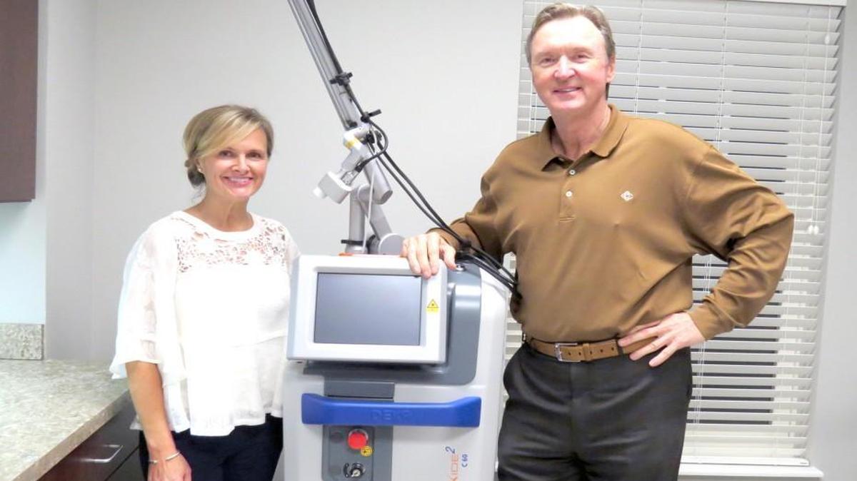 Southeast Sculpting and Rejuvenation’s Michelle Hirsch and Dr. Joe Robinson with the MonaLisa Touch CO2 laser used for treatment of post-menopausal symptoms. The medical spa is the first in the Charlotte area to offer the treatment.
