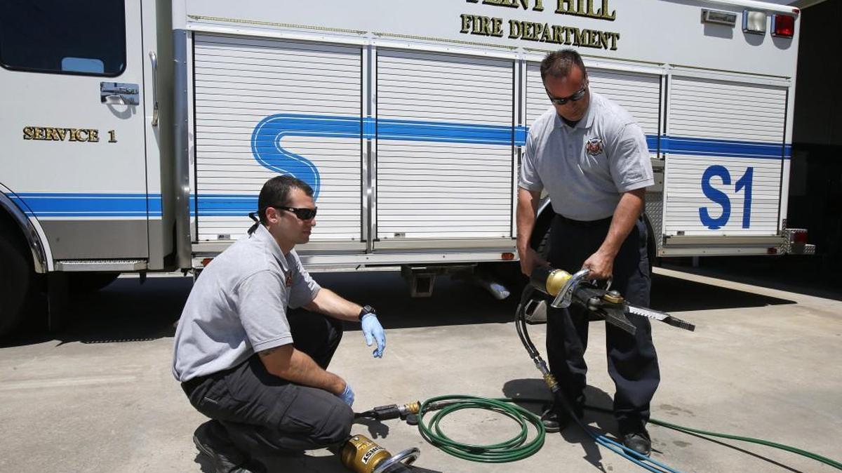 Firefighters Omar Kasso, left, and Ken Sallenger conduct a weekly test of equipment at the Flint Hill Fire Department. The department is hoping a federal grant can help cover the cost of adding staff. Residential growth means Flint Hill and other departments need to grow as well.