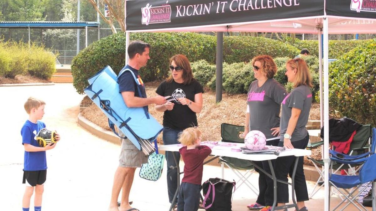 Players in a past Kickin' It Challenge are signed in to play at Manchester Meadows. This is the third edition of the annual fundraiser.