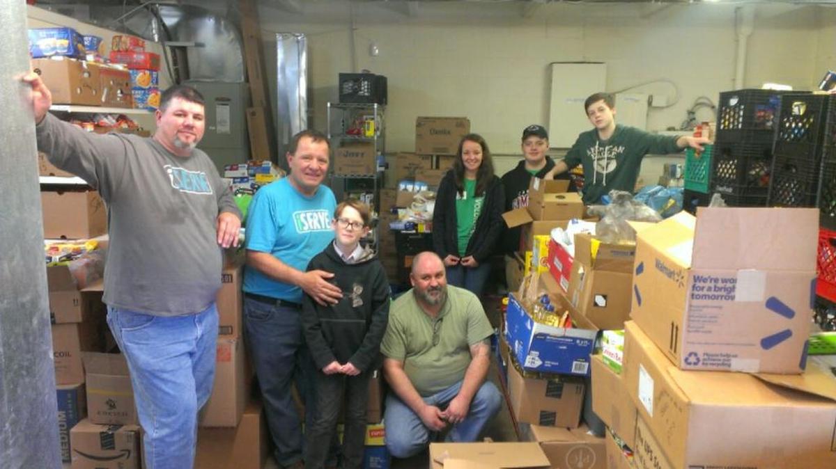 New River Community Church members spent one hour unloading and another hour sorting the congregation’s two-ton donation Dec. 13 to Clover Area Assistance Center.