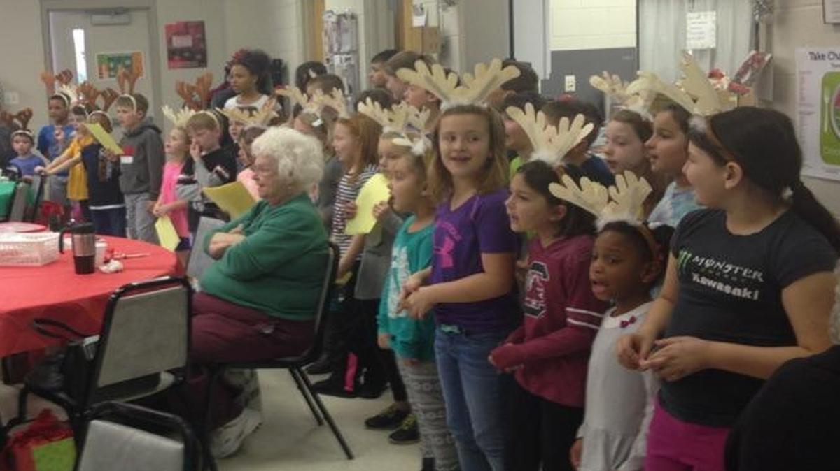 Children from the Indian Land after school program sing Christmas songs at the Indian Land Senior Center.