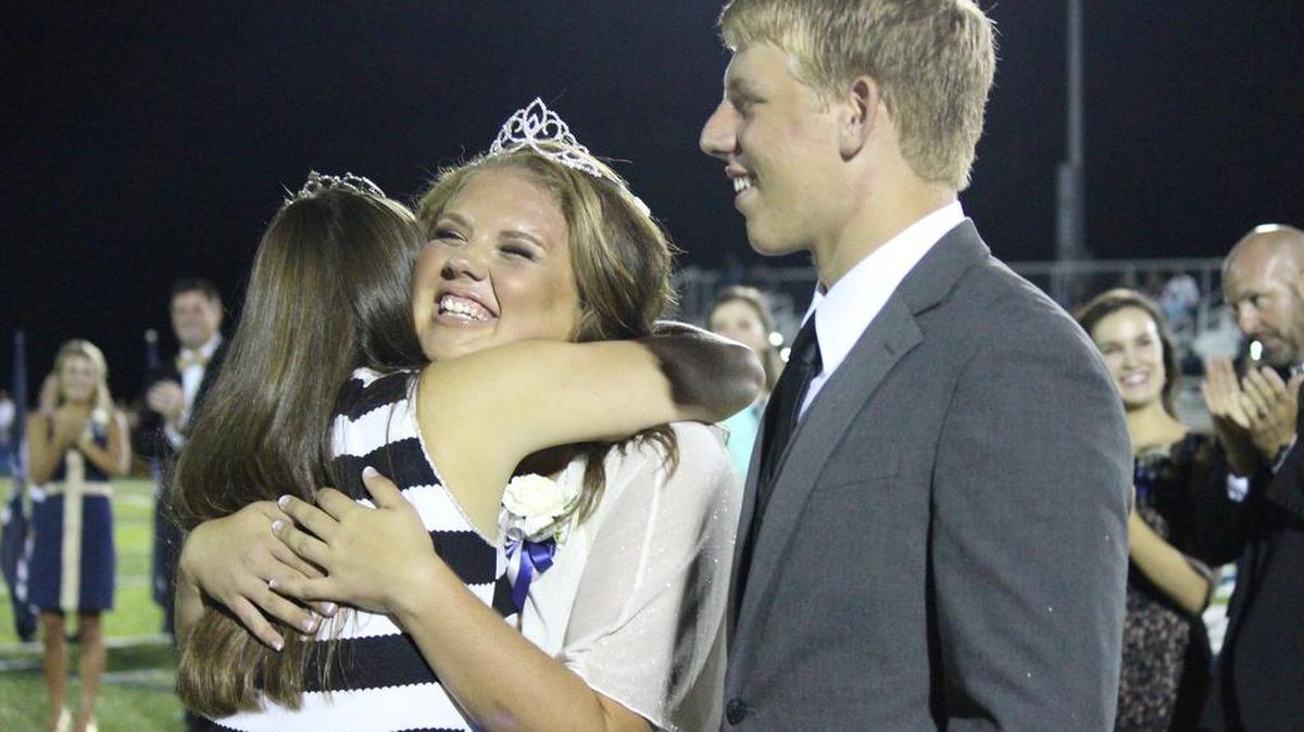 
Clover High School senior Morgan Glover is crowned as the 2015 homecoming queen by last year’s winner Sydney Burrell. She was escorted by her brother, sophomore Matthew Glover.
