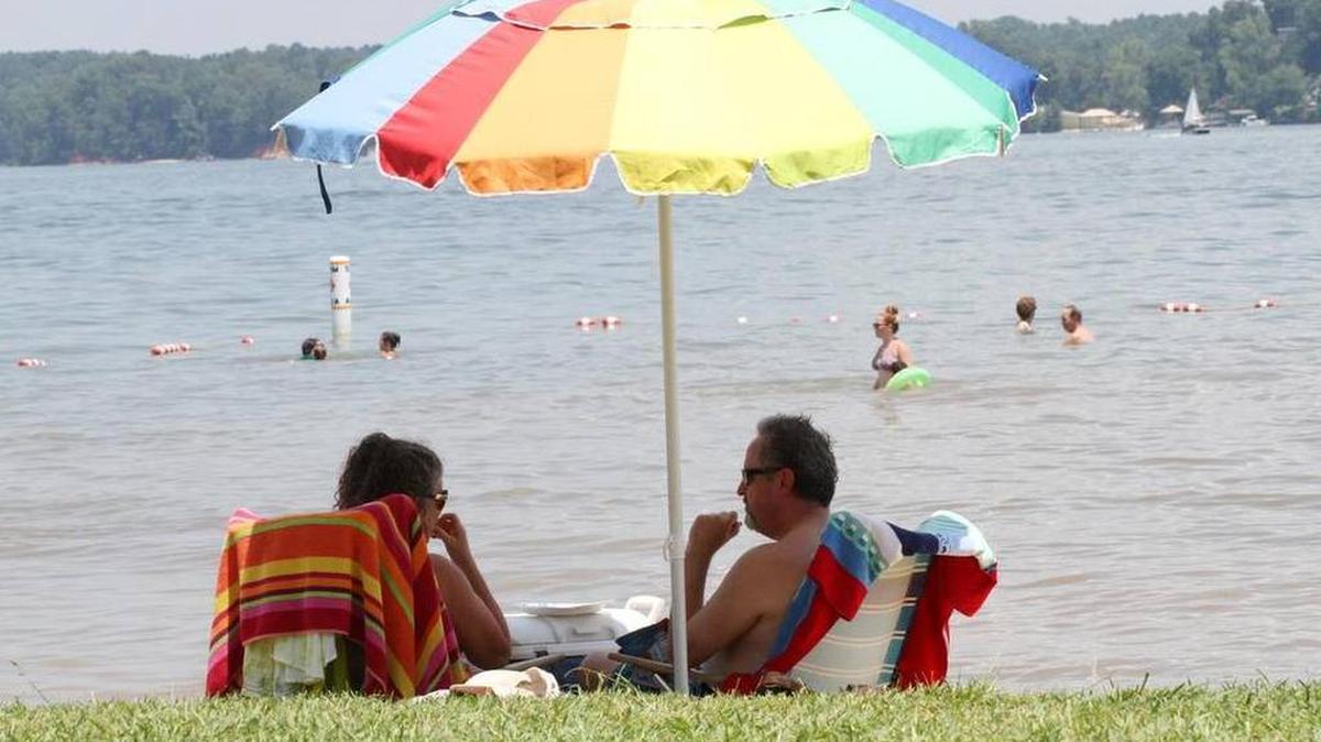 As temperatures soared into the 90s, dozens flocked to Lake Wylie to swim and sunbathe.