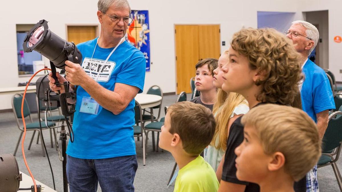 Rick Diak teaches campers about stage lighting during summer arts camp at St. John's United Methodist Church in Fort Mill.
