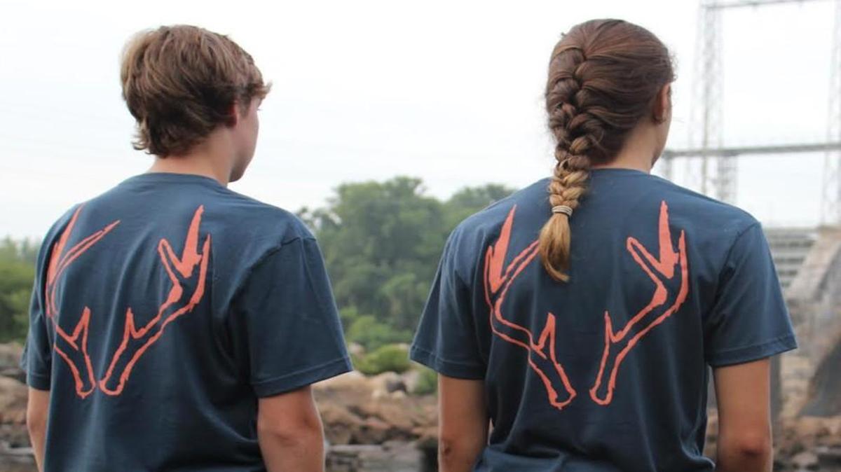 Fort Mill teenagers Trevor Gray, left, and Olivia Lininger model Don Raven T-shirts designed by their friend and company founder, 17-year-old Ezekiel MacMillan.