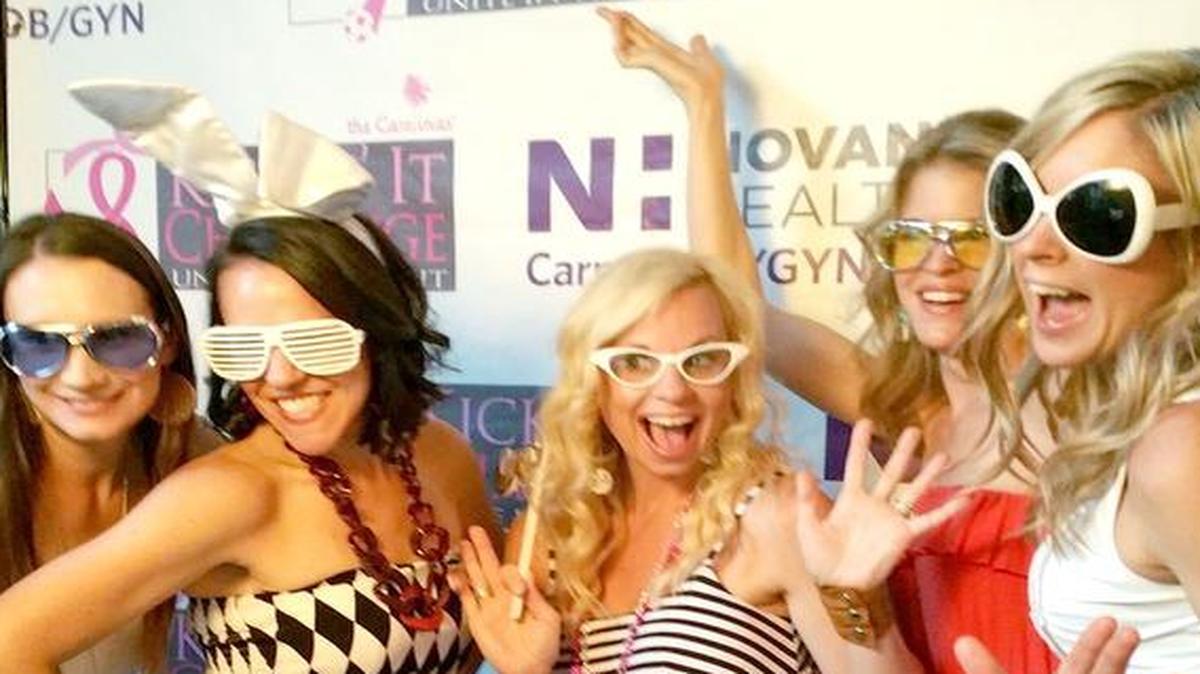 
From left, Lisa Payne, Kristi Rossi, Ashley Gordon, Melanie Zook and Kassy Archer have fun with the Pink Carpet photo booth sponsored by Novant Health Carmel OB/GYN Associates.
