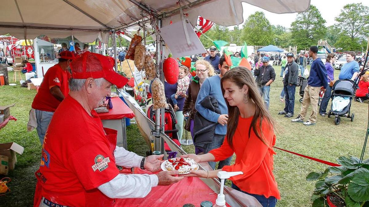Ashleigh Walsh stops in for a funnel cake at the S.C. Strawberry Festival. A wide range of vendor foods at the festival will be made with strawberries.
