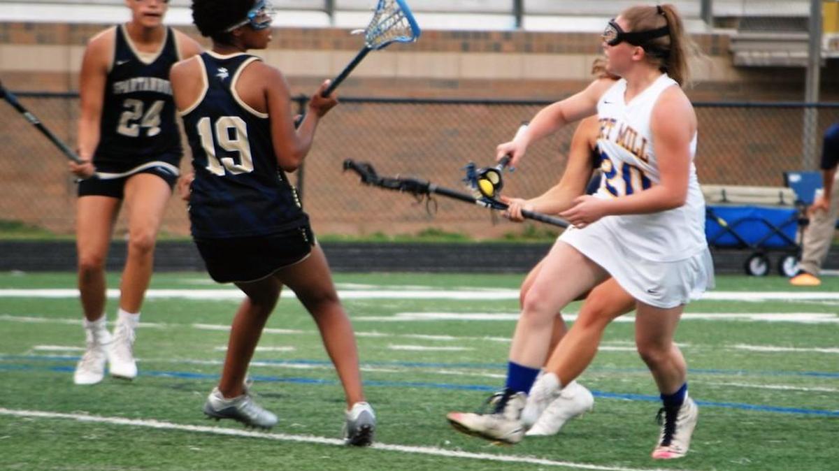 Fort Mill’s Amanda Brown runs up the field with the ball during the Jackets second round playoff game against Spartanburg.