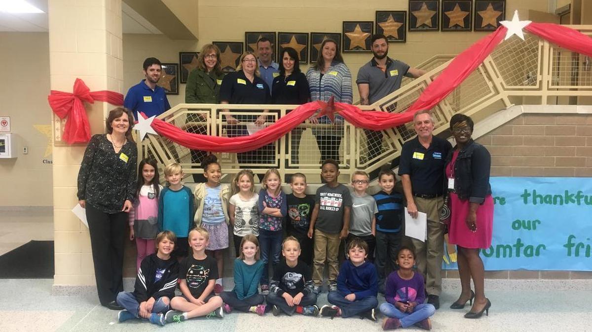 Employees with Domtar Corporation recently visited Riverview Elementary School.