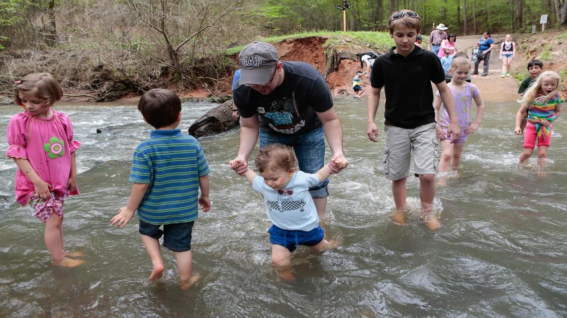 
At Saturday’s 20th anniversary Earth Day celebration at the Anne Springs Close Greenway, visitors splash around in the creek on what turned out to be a nice day.
