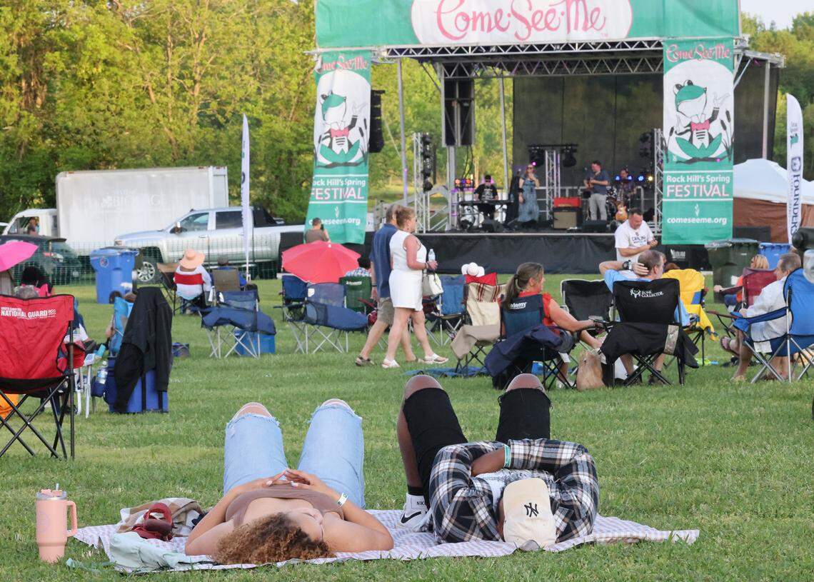 Spectators watch a band Friday at Moonlight Jazz & Blues as part of the Come-See-Me Festival at Winthrop Lake.