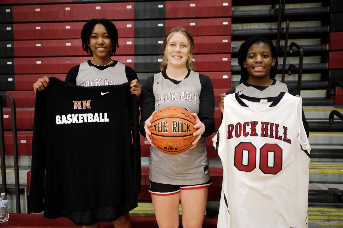 From left, Sarah Anderson-Wildy, Chloe Hudson and De’Ashaj Crawford — members of the Rock Hill High School basketball team — hold gifts they sent to Dorothy Jones in Rock Hill, SC to celebrate her 103rd birthday.