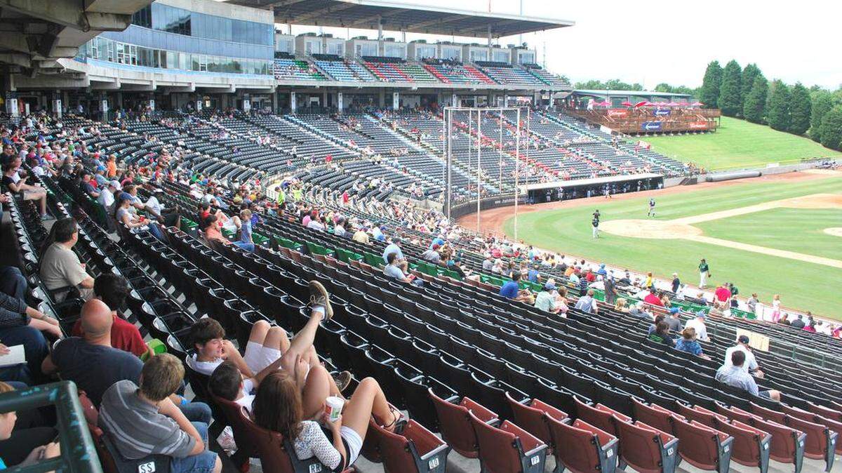 A sparse crowd of 3,711 watches the Charlotte Knights in the first game of a doubleheader Sunday against the Durham Bulls at Knights Stadium. Crowds this size havenaït helped the Knights during their stay in Fort Mill over the past two and-a-half decades. The Knights are hoping for a better turnout next year when the team moves into a new stadium in Uptown Charlotte.