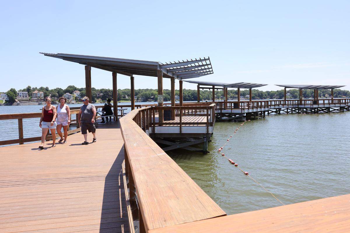 Visitors to Ebenezer Park take a stroll Monday. The York County Parks Department issued a statement that said park staff will turn away traffick once the park is at capacity.