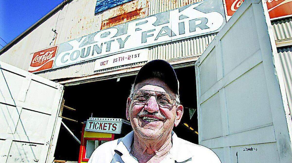 Pete Stathopoulos of Rock Hill stands outside the main building at the York County Fair Grounds on Monday. Stathopulos, 79, has been working the York County Fair for 50 years, but will be retiring after this year. The fair, in its 85th year, will not be held at the fairgrounds after this year, and no plans have been announced to hold the fair elsewhere.