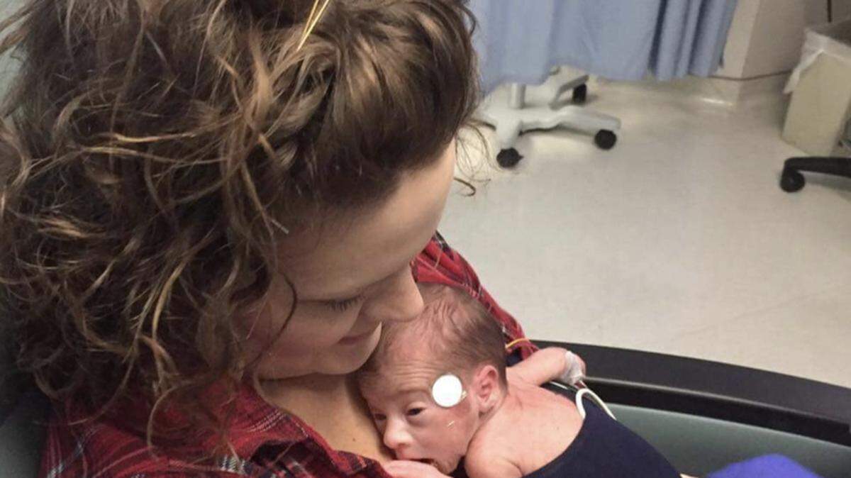Rylan Payne with his mom, Kendra Payne, while in the NICU. His parents were only allowed hold him in this position at first.